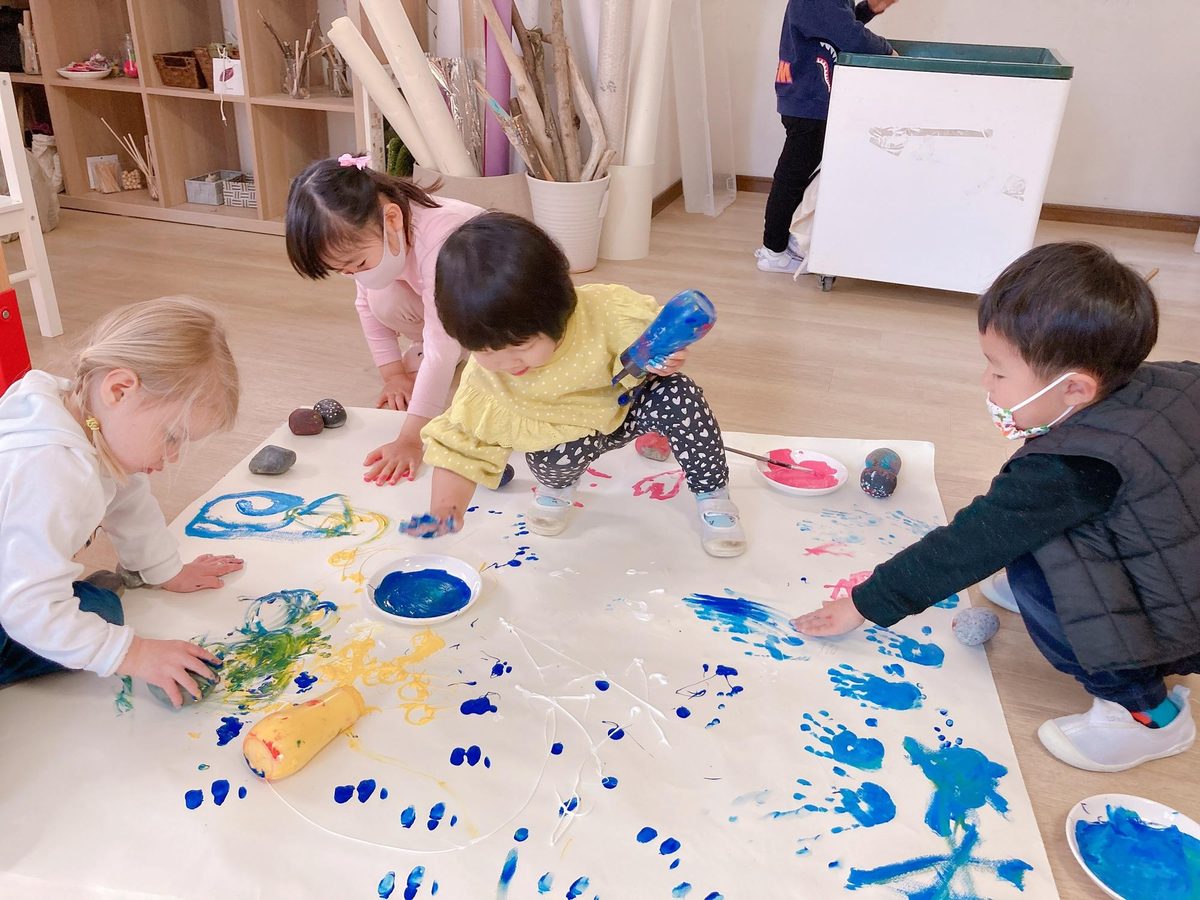 A child freely expressing themselves with paint